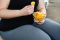 Fat woman overeating junk food. sedentariness Royalty Free Stock Photo