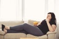 Fat woman overeating junk food. sedentariness Royalty Free Stock Photo