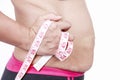 Fat woman pinching her fat tummy on white background. Royalty Free Stock Photo