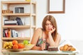 Fat woman sitting at table home