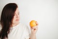 Fat woman snacking with fruits. Eat healthy