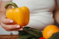 Fat woman snacking with fruits and vegetables Royalty Free Stock Photo