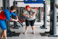 Fat woman training with instructor, hard workout Royalty Free Stock Photo