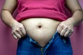Fat woman trying to wear jeans, Overweight fat woman, Weight losing, obesity, cellulite, health care concept Royalty Free Stock Photo