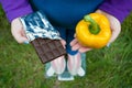 Fat woman wants to lose weight diet top view in blue suit stands on transparent glass scales in pink sneakers on green grass Royalty Free Stock Photo