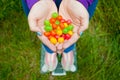 Fat woman wants to lose weight holds in hands folded boat small colored candies Royalty Free Stock Photo