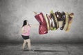 Fat woman punching unhealthy foods Royalty Free Stock Photo