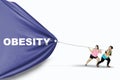 Fat women dragging Obesity text Royalty Free Stock Photo