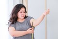 Fat women are sad because of the increase in size after checking with a tape measure Royalty Free Stock Photo