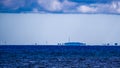 Fata Morgana (mirage) of coastline with wind turbines