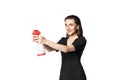 The fatal woman in a black dress with a spray for washing glasses pretending to be a secret agent, holding a spray like a gun.