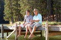 Father and adult son fishing in lake Royalty Free Stock Photo