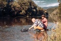 Father and adult son fishing lakeside. Handsome men relaxing outside. It is not sport it is obsession. Guy fly fishing