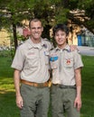 Father and Amerasian son enjoying the Boy Scouts of America in their uniforms.