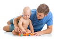 Father and baby boy have fun with musical toys Royalty Free Stock Photo