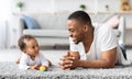 Father Baby Connection. Happy Black Man Bonding With Infant Child At Home Royalty Free Stock Photo