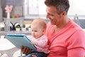 Father and baby daughter using tablet Royalty Free Stock Photo