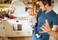 Father with a baby girl at home.