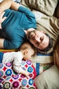 Father with a baby girl at home sleeping. Royalty Free Stock Photo