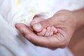 Father and baby hand