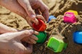 Father and baby hands playing with sand at the beach Royalty Free Stock Photo