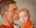 Father kissing his baby son Royalty Free Stock Photo