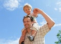 Father and baby son piggyback Royalty Free Stock Photo