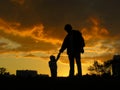 Father with baby sunset