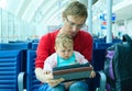 Father and baby waiting in the airport