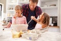 Father baking with children Royalty Free Stock Photo