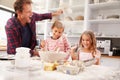 Father baking with children Royalty Free Stock Photo