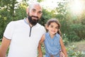 Playfull daughter child with bald man father outdoor