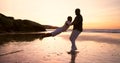 Father, beach and playing swing with boy, happy and smile for joy, sunset and playful. Parent, child and fun with dad