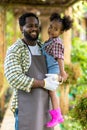 Father with beard holding his Daughter in his arms