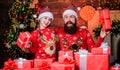 Father bearded man and daughter near christmas tree. Spend time with your family. Dad and child opening christmas gifts Royalty Free Stock Photo