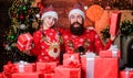 Father bearded man and daughter near christmas tree. Gifts for nearest. Spend time with your family. Dad and child