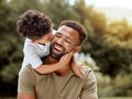 Father, bonding kiss and boy child hug happy in nature with quality time together outdoor. Happiness, laughing and Royalty Free Stock Photo