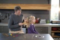 Father brushing daughters hair