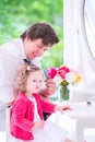 Father brushing hair of his beautiful daughter Royalty Free Stock Photo