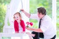 Father brushing hair of his sweet daughter Royalty Free Stock Photo