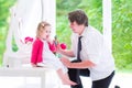 Father brushing his daughter hair Royalty Free Stock Photo