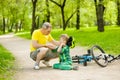 Father calms son that fell from the bike
