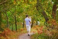 Father carrying his shild during walk in forest