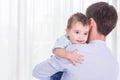 Father carrying his son. Good health baby smiling on shoulder of Royalty Free Stock Photo