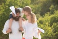 Father carrying his son on shoulders. Childcare. Family travel and vacation concept. Freedom to dream. Boy playing with Royalty Free Stock Photo