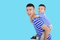 Father Carrying  son Piggyback and Having Fun Royalty Free Stock Photo