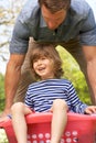 Father Carrying Son Sitting In Laundry Basket Royalty Free Stock Photo