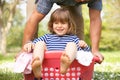 Father Carrying Son Sitting In Laundry Basket Royalty Free Stock Photo