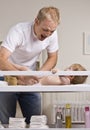 Father Changing Diapers Royalty Free Stock Photo