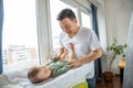 Father changing diapers to his newborn son Royalty Free Stock Photo